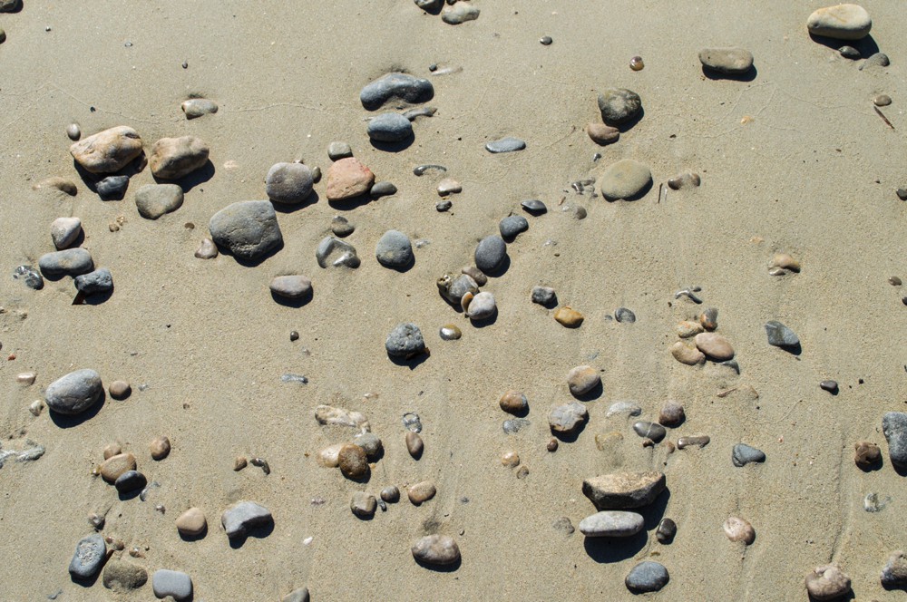 Stones in sand on Playa de Formentor
